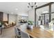 Modern dining room with wood table and kitchen view at 4140 S Inca St, Englewood, CO 80110