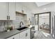 Modern kitchen with stainless steel appliances and white shaker cabinets at 4140 S Inca St, Englewood, CO 80110