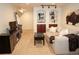 Finished basement featuring a comfortable seating area, built-in shelves, and modern lighting at 8146 E Harvard Cir, Denver, CO 80231