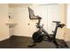 Functional home gym area equipped with a Peloton bike, side counter, and neutral walls for a clean workout environment at 8146 E Harvard Cir, Denver, CO 80231