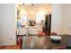 Cozy kitchen with granite countertops, stainless steel appliances, and an adjacent dining area at 8146 E Harvard Cir, Denver, CO 80231