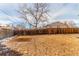 The spacious backyard is surrounded by a wood fence, offering privacy and a great outdoor space at 6758 W Louisiana Pl, Lakewood, CO 80232