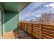 Balcony with wood deck and railing, and green siding at 6758 W Louisiana Pl, Lakewood, CO 80232