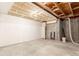 Basement area ready for customization, showcasing exposed ceiling and concrete flooring at 6758 W Louisiana Pl, Lakewood, CO 80232