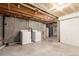 Unfinished basement featuring washer and dryer hookups at 6758 W Louisiana Pl, Lakewood, CO 80232