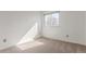 Bedroom featuring carpet, bright light from a window, and electrical outlets at 6758 W Louisiana Pl, Lakewood, CO 80232