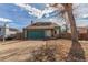 Cozy single-Gathering home with a spacious driveway, two-car garage, manicured lawn and curb appeal at 6758 W Louisiana Pl, Lakewood, CO 80232