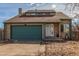 Attractive single-Gathering home with a two-car garage, a well-kept lawn, and a welcoming entrance at 6758 W Louisiana Pl, Lakewood, CO 80232