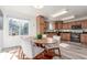 Bright kitchen with stainless steel appliances and a lovely breakfast nook at 6758 W Louisiana Pl, Lakewood, CO 80232