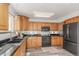 Well-equipped kitchen with stainless steel appliances and ample counter space at 6758 W Louisiana Pl, Lakewood, CO 80232