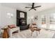 Cozy living room with a black brick fireplace and stylish decor at 6758 W Louisiana Pl, Lakewood, CO 80232