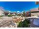 An inviting backyard featuring rock landscaping and mature trees at 8054 E 152Nd Dr, Thornton, CO 80602