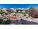 Scenic backyard featuring gravel, stone details, and thoughtfully arranged landscaping at 8054 E 152Nd Dr, Thornton, CO 80602