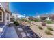 Landscaped backyard featuring gravel, rock accents, and varied plant life at 8054 E 152Nd Dr, Thornton, CO 80602