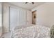 Bedroom featuring a cozy bed with sliding door closet and stylish decor at 8054 E 152Nd Dr, Thornton, CO 80602