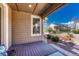 View from the shaded patio showing the yard with gravel landscaping and neighboring home at 8054 E 152Nd Dr, Thornton, CO 80602