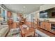 Spacious living room with open layout, hardwood floors, and seamless transition to the kitchen at 8054 E 152Nd Dr, Thornton, CO 80602