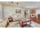 Inviting living room area with hardwood floors, comfortable seating, and seamless access to the kitchen at 8054 E 152Nd Dr, Thornton, CO 80602