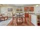 Cozy living room with modern decor, hardwood floors, adjacent to dining and kitchen areas at 8054 E 152Nd Dr, Thornton, CO 80602