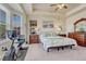 Bright main bedroom with tray ceilings, a ceiling fan, and neutral decor at 8054 E 152Nd Dr, Thornton, CO 80602