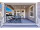 Inviting covered patio with comfortable seating and a welcoming atmosphere at 8054 E 152Nd Dr, Thornton, CO 80602