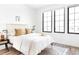 Bedroom with gold bed frame and large windows at 3408 W 17Th Ave, Denver, CO 80204