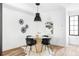 Bright dining area with round table and modern chairs at 3408 W 17Th Ave, Denver, CO 80204