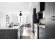 Modern kitchen with dark cabinetry, stainless steel appliances, and an island at 3408 W 17Th Ave, Denver, CO 80204