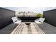 Relaxing rooftop deck with fire pit, comfortable seating, and city views at 3408 W 17Th Ave, Denver, CO 80204