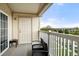 Cozy balcony with seating and a view of the neighborhood, perfect for relaxing outdoors at 5745 N Genoa Way # 306, Aurora, CO 80019