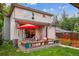 Inviting backyard featuring a patio with comfortable seating, and a well-maintained lawn at 4220 Quitman St, Denver, CO 80212
