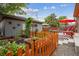 A well-kept backyard with a garden, fence, seating area, and unique features for gardening enthusiasts at 4220 Quitman St, Denver, CO 80212