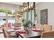Dining room with decorative lighting, large windows, and exterior views at 4220 Quitman St, Denver, CO 80212
