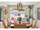 Dining room featuring modern lighting and patio views, seamlessly blending indoor and outdoor living at 4220 Quitman St, Denver, CO 80212