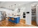 Bright, modern kitchen with white cabinets, stainless steel appliances and a pantry at 4220 Quitman St, Denver, CO 80212