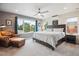 Spacious main bedroom with ample natural light, neutral color palette, and a ceiling fan at 4220 Quitman St, Denver, CO 80212