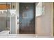Modern shower with sleek black tiling, glass enclosure, and high-end fixtures at 4220 Quitman St, Denver, CO 80212