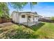Charming single-story home with a well-maintained backyard and a covered patio, perfect for outdoor entertaining at 12829 E Nevada Ave, Aurora, CO 80012