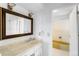 Well-lit bathroom with white vanity, marble countertop, and traditional fixtures at 12829 E Nevada Ave, Aurora, CO 80012
