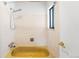 This bathroom features a shower, a window, and a white tiled wall at 12829 E Nevada Ave, Aurora, CO 80012