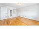 Bright bedroom features hardwood floors, a window and neutral paint at 12829 E Nevada Ave, Aurora, CO 80012