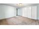 Comfortable bedroom featuring carpet and a large closet, offering ample storage solutions at 12829 E Nevada Ave, Aurora, CO 80012