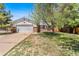 Charming single-Gathering home featuring a two-car garage and a well-maintained front yard at 12829 E Nevada Ave, Aurora, CO 80012