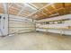 Spacious two-car garage with ample storage space and a workbench area at 12829 E Nevada Ave, Aurora, CO 80012