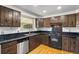 Well-equipped kitchen with stainless steel appliances, dark cabinets, and updated hardware at 12829 E Nevada Ave, Aurora, CO 80012