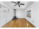 Living space with hardwood floors, a modern fireplace, a window with a view, and modern ceiling fan at 12829 E Nevada Ave, Aurora, CO 80012