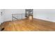 Elegant entry features pristine hardwood floors, white walls, and an ornate stair railing at 12829 E Nevada Ave, Aurora, CO 80012