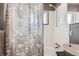 Clean bathroom with a shower/tub combo and updated vanity at 7625 W 23Rd Pl, Lakewood, CO 80214