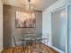 Small dining area with glass table and chairs at 7625 W 23Rd Pl, Lakewood, CO 80214