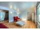 Living room with hardwood floors and red couches at 7625 W 23Rd Pl, Lakewood, CO 80214